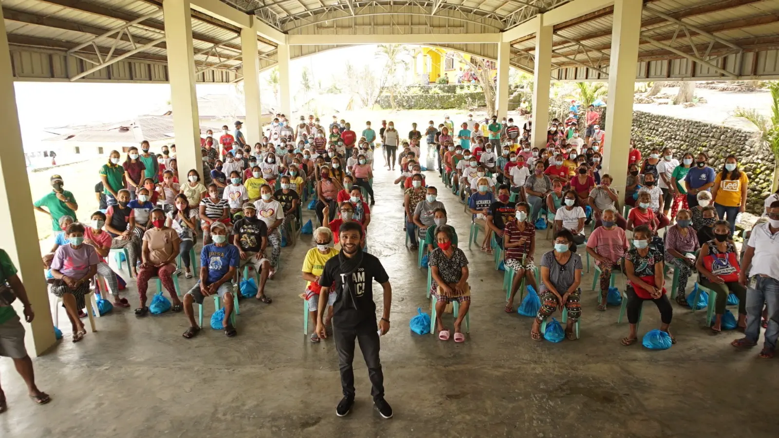 Daud Ayub with a community outreach gathering